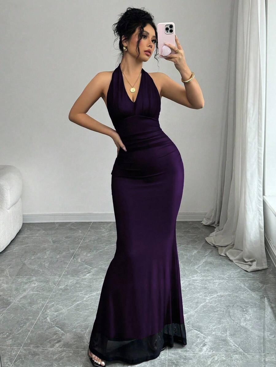 Women's long sleeve mermaid bodycon dress in high-stretch mesh fabric featuring a halter backless neckline, ruched high waist, and slim fit silhouette for formal evening wear.