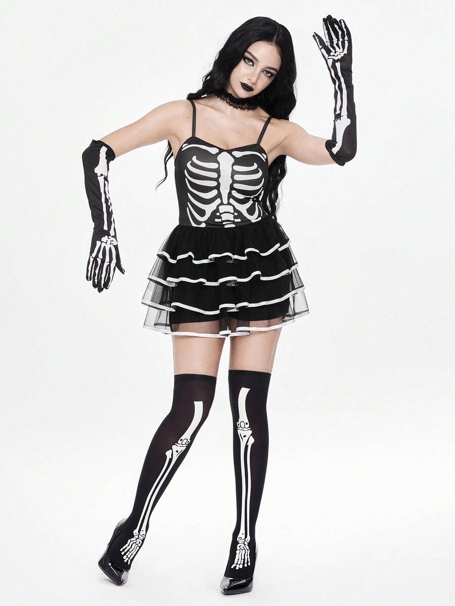 Women wearing a black goth skeleton mesh suspender mini cake dress featuring tiered ruffle hem, spaghetti straps, high waist slim fit, and matching arm sleeves.