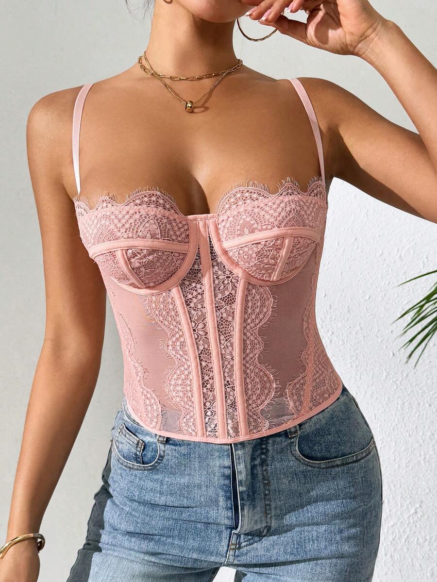 Front view of a black seamless lace camisole crop top featuring delicate spaghetti straps and intricate contrast lace detailing.