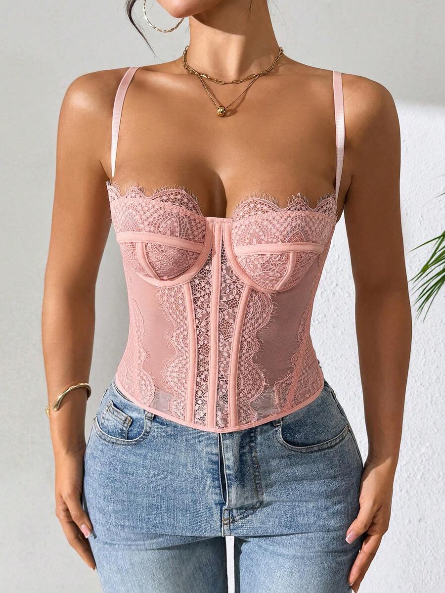Front view of a black seamless lace camisole crop top featuring delicate spaghetti straps and intricate contrast lace detailing.