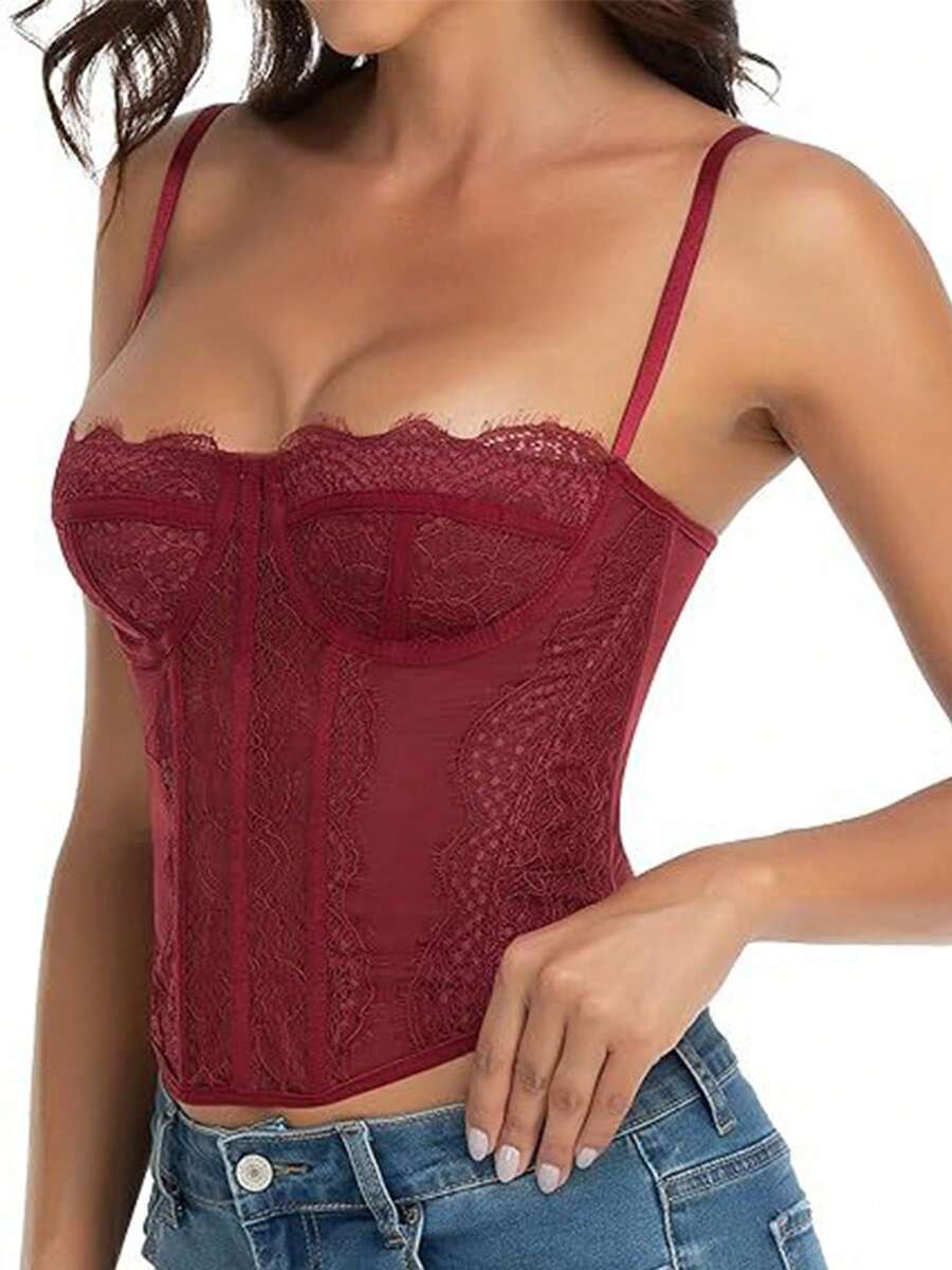 Black lace bustier corset top for women with buckle detail, spaghetti straps, slim fit, and lightweight mesh fabric for a night out look.
