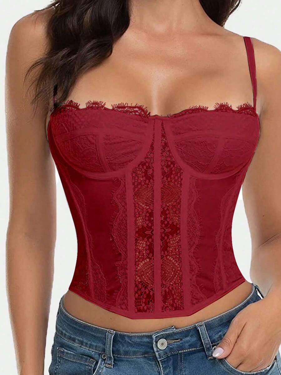 Black lace bustier corset top for women with buckle detail, spaghetti straps, slim fit, and lightweight mesh fabric for a night out look.