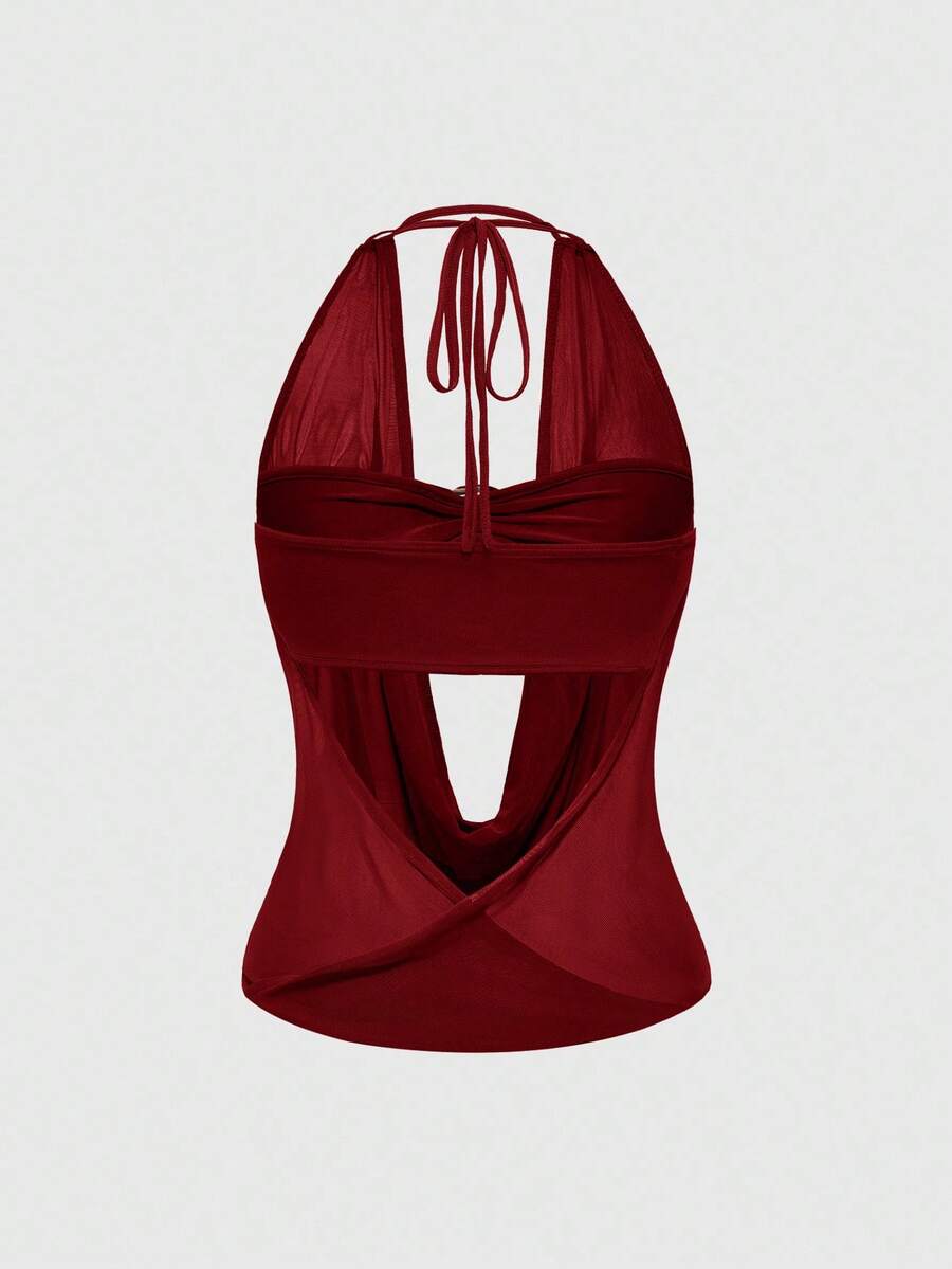 Women's cowl neck halter crop tank top featuring a draped backless design and matching bandeau inner layer.