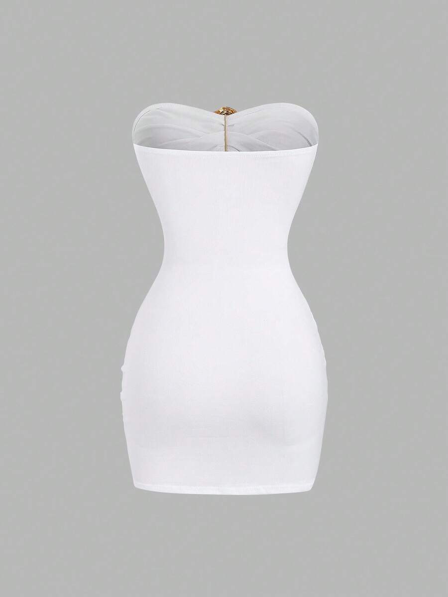 Women's black strapless bodycon mini dress featuring ruched detailing, cut-out design with ring accent, mid-waist pencil hem, and slim fit knitted stretch fabric.
