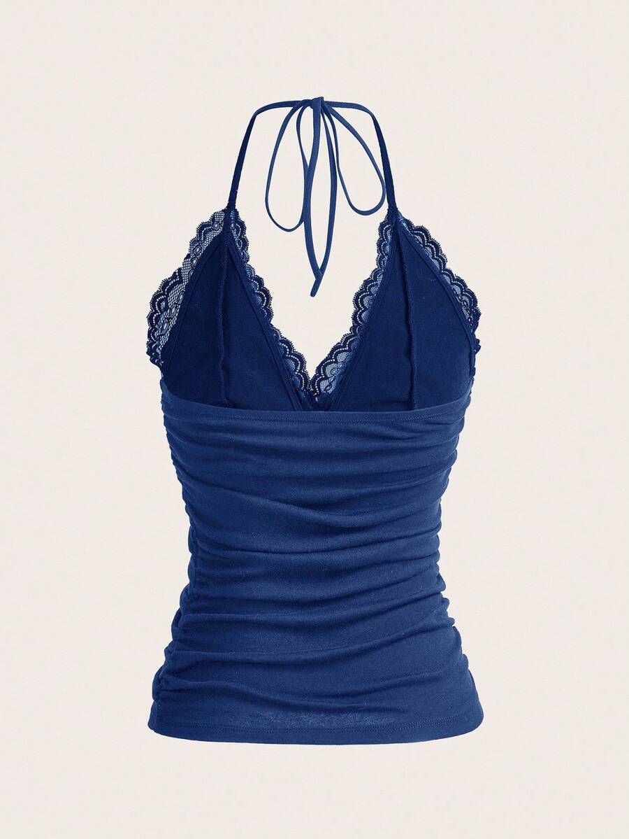 A women's black backless halter top featuring contrast lace trim, ruched front detail, and slim fit soft knitted fabric.
