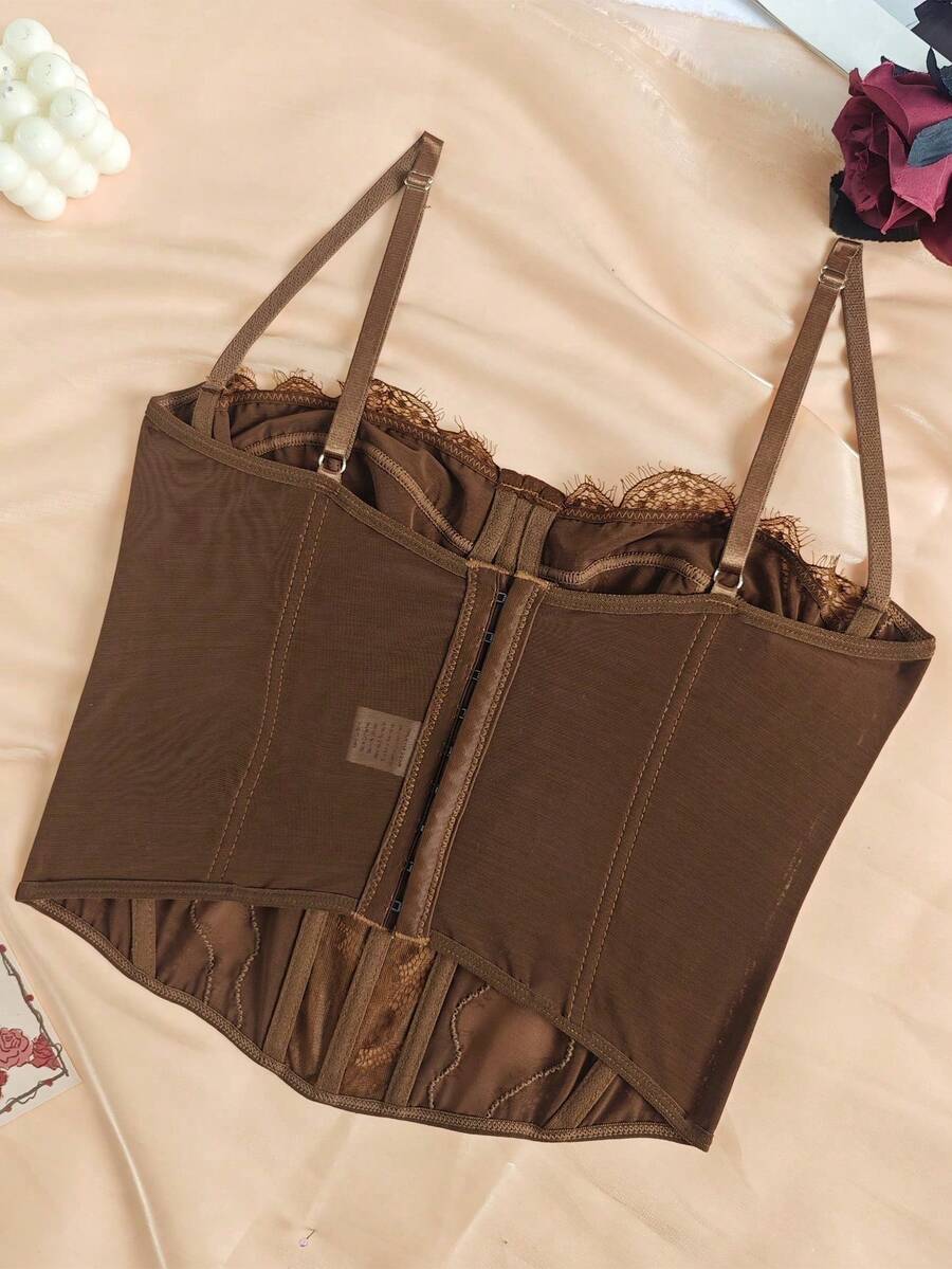 Women's brown lace trim cami corset crop top featuring a low cut neck, unlined body, and slim fit bodycon silhouette.