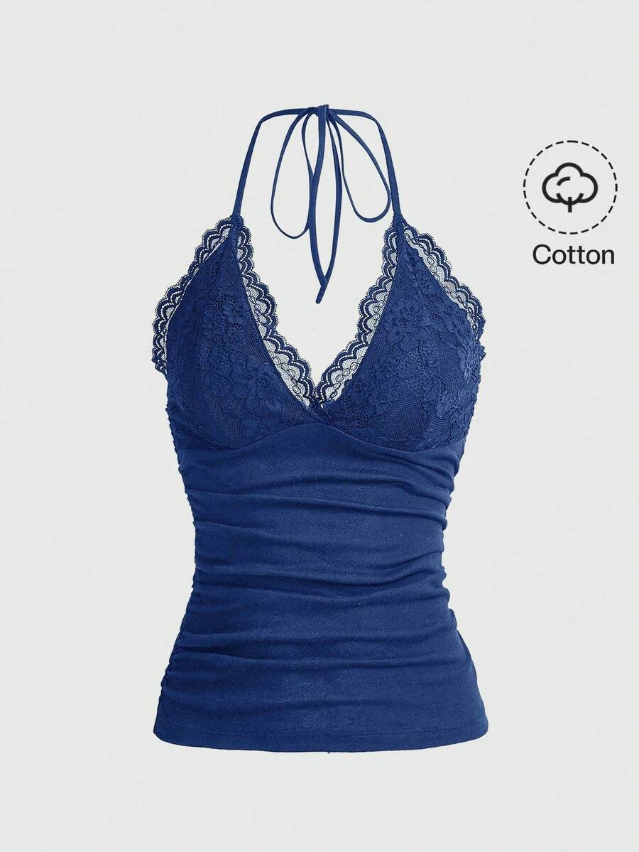 A women's black backless halter top featuring contrast lace trim, ruched front detail, and slim fit soft knitted fabric.