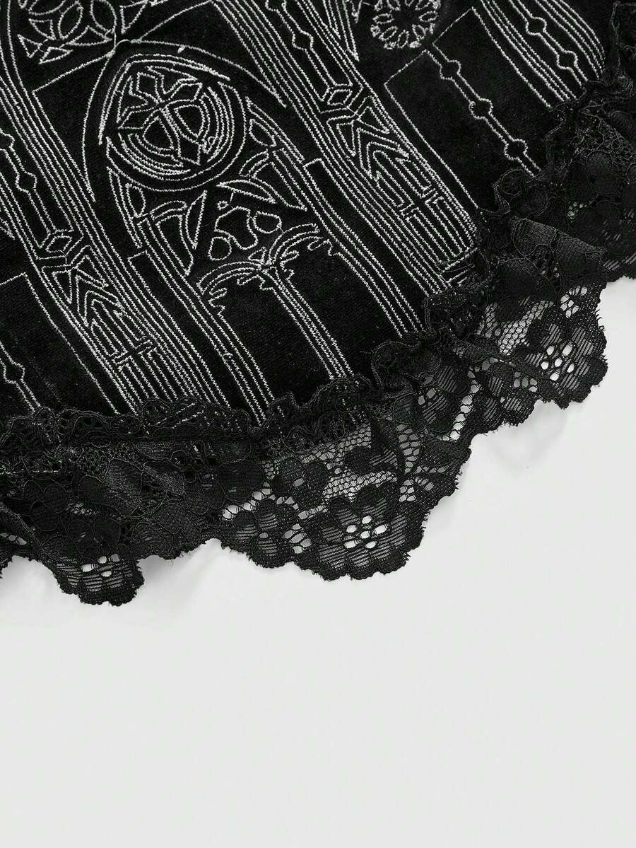 Black gothic velvet crop camisole for women featuring contrast lace trim, an asymmetrical hem, graphic print, and strap shoulder design.