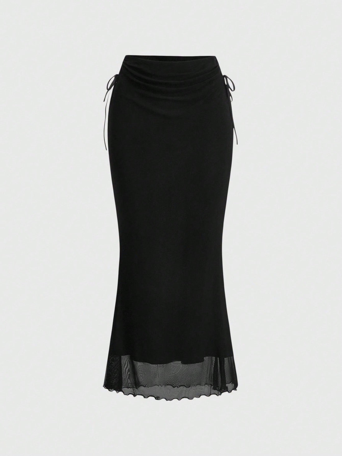 Woman wearing a solid black fairycore drawstring mermaid long skirt featuring ruched side detailing, lettuce trim, and a high side slit.
