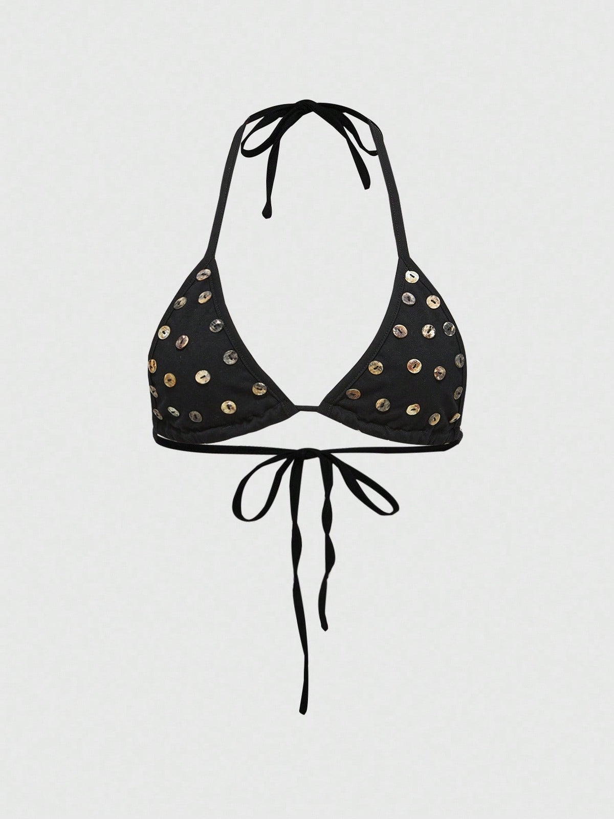 Black halter micro crop top featuring a backless tie-back design with shell button details on a woman.
