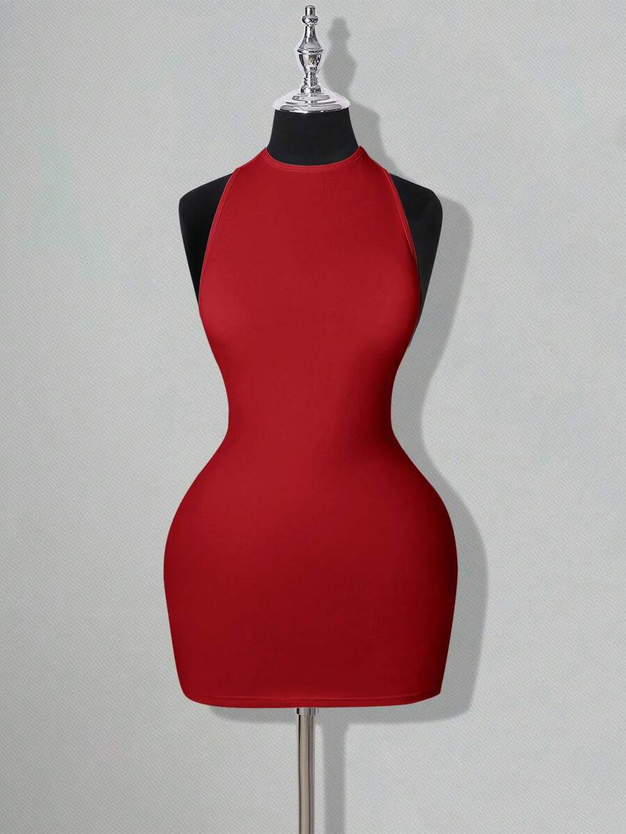 Apricot criss-cross backless bodycon mini dress for women featuring a round neck and rhinestone accent details.
