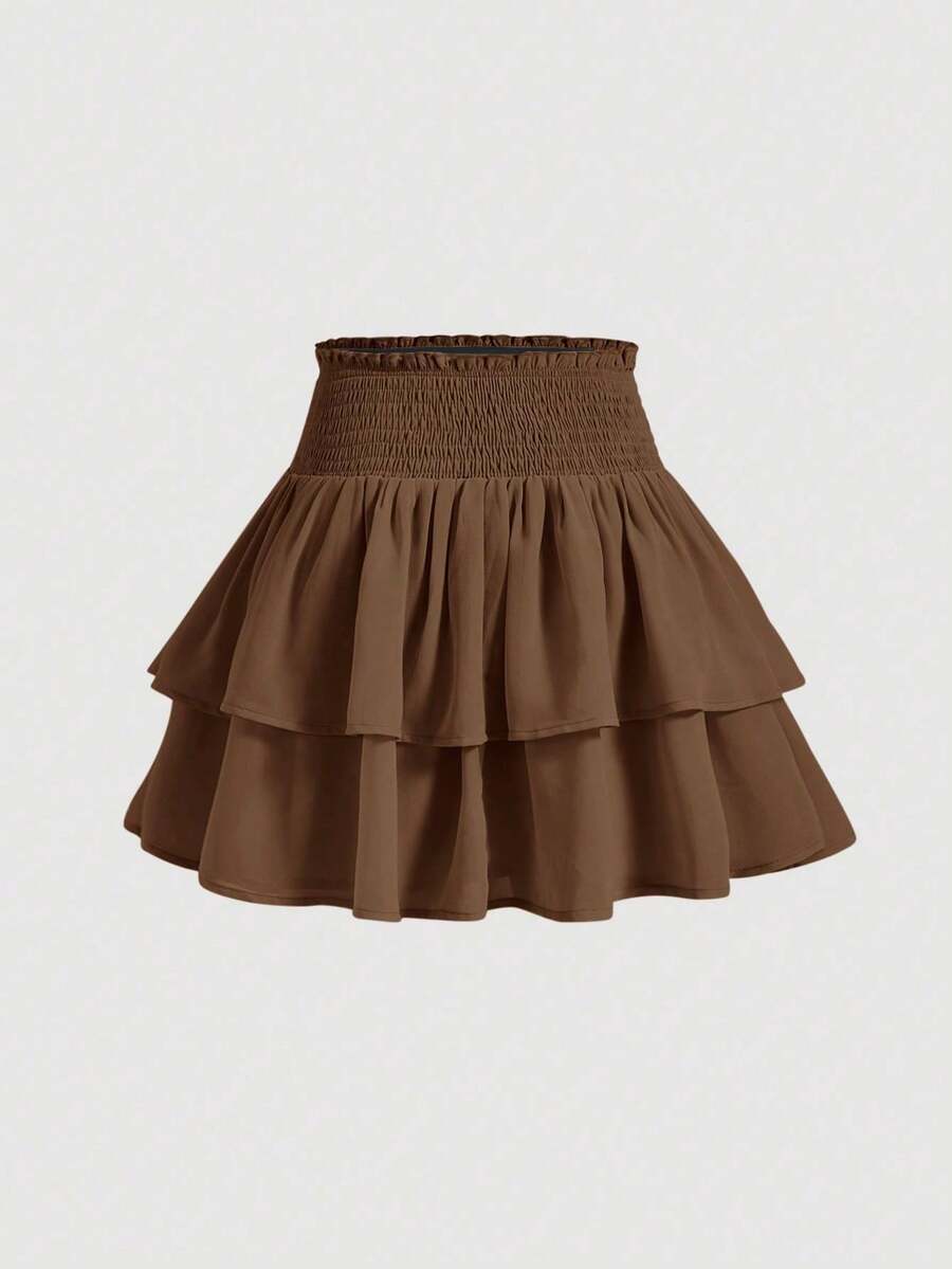 Women's high waist tiered ruffle layered mini skort in black featuring shirred details and ruffle hem.