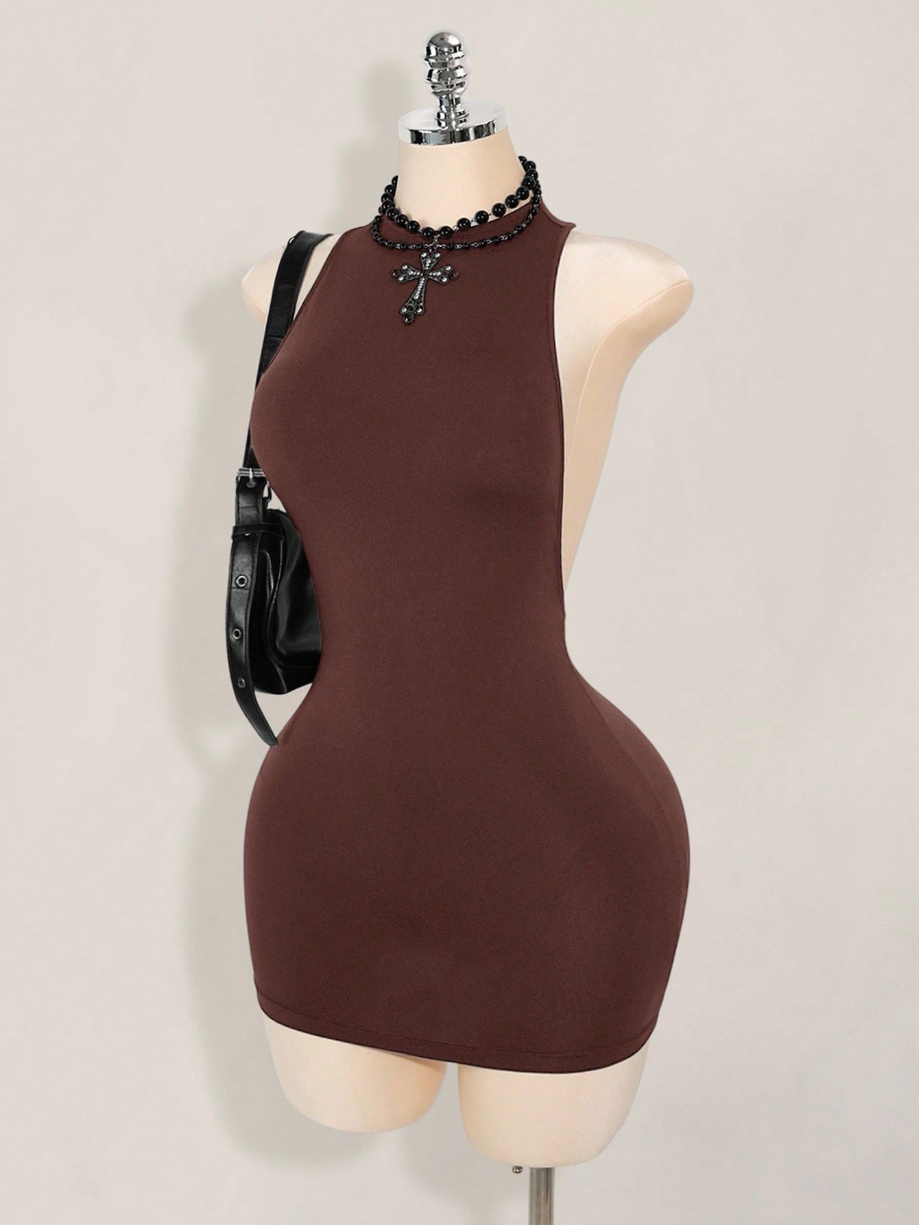 Apricot criss-cross backless bodycon mini dress for women featuring a round neck and rhinestone accent details.
