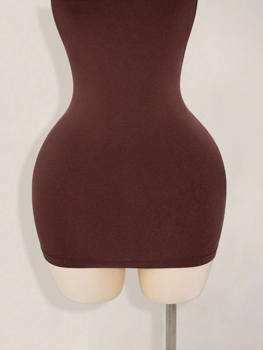 Apricot criss-cross backless bodycon mini dress for women featuring a round neck and rhinestone accent details.