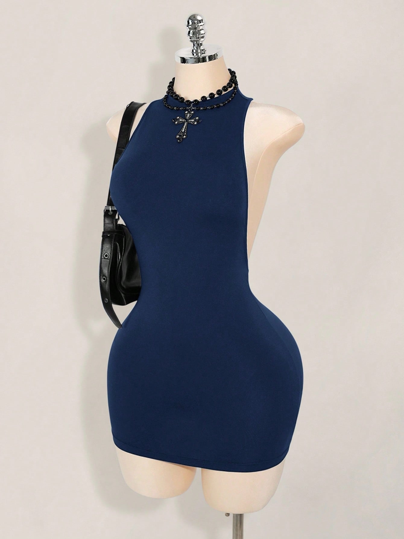 Apricot criss-cross backless bodycon mini dress for women featuring a round neck and rhinestone accent details.