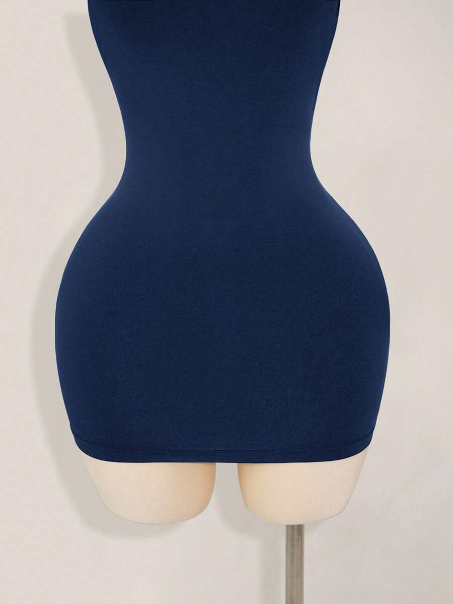 Apricot criss-cross backless bodycon mini dress for women featuring a round neck and rhinestone accent details.