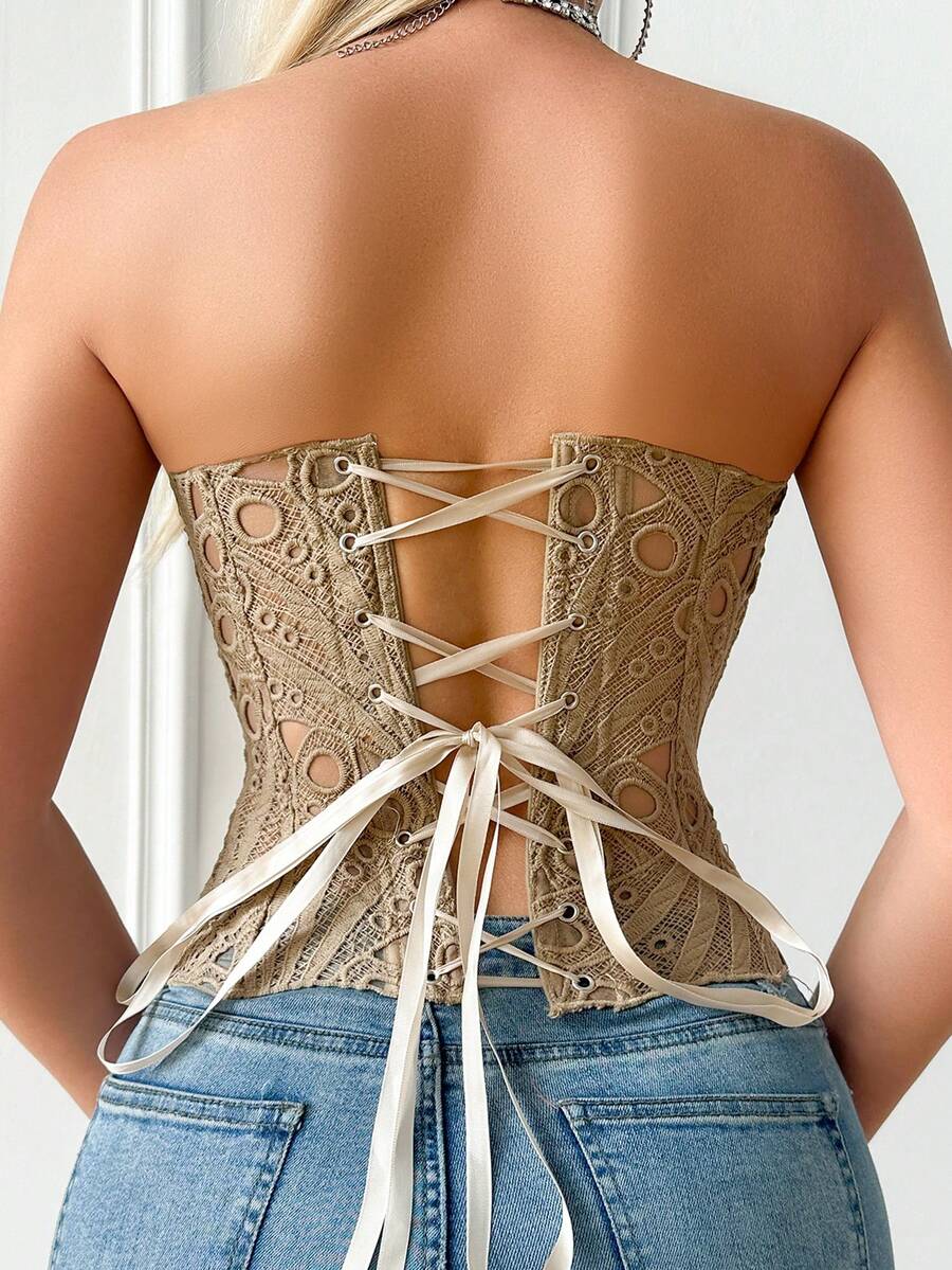 Black lace shaping camisole top with a tie-back detail and grommet eyelet accents, designed for women with slight stretch and ultra-light support.
