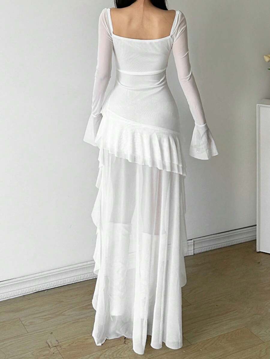 Woman wearing a solid off-the-shoulder asymmetrical midi dress with long flare sleeves.