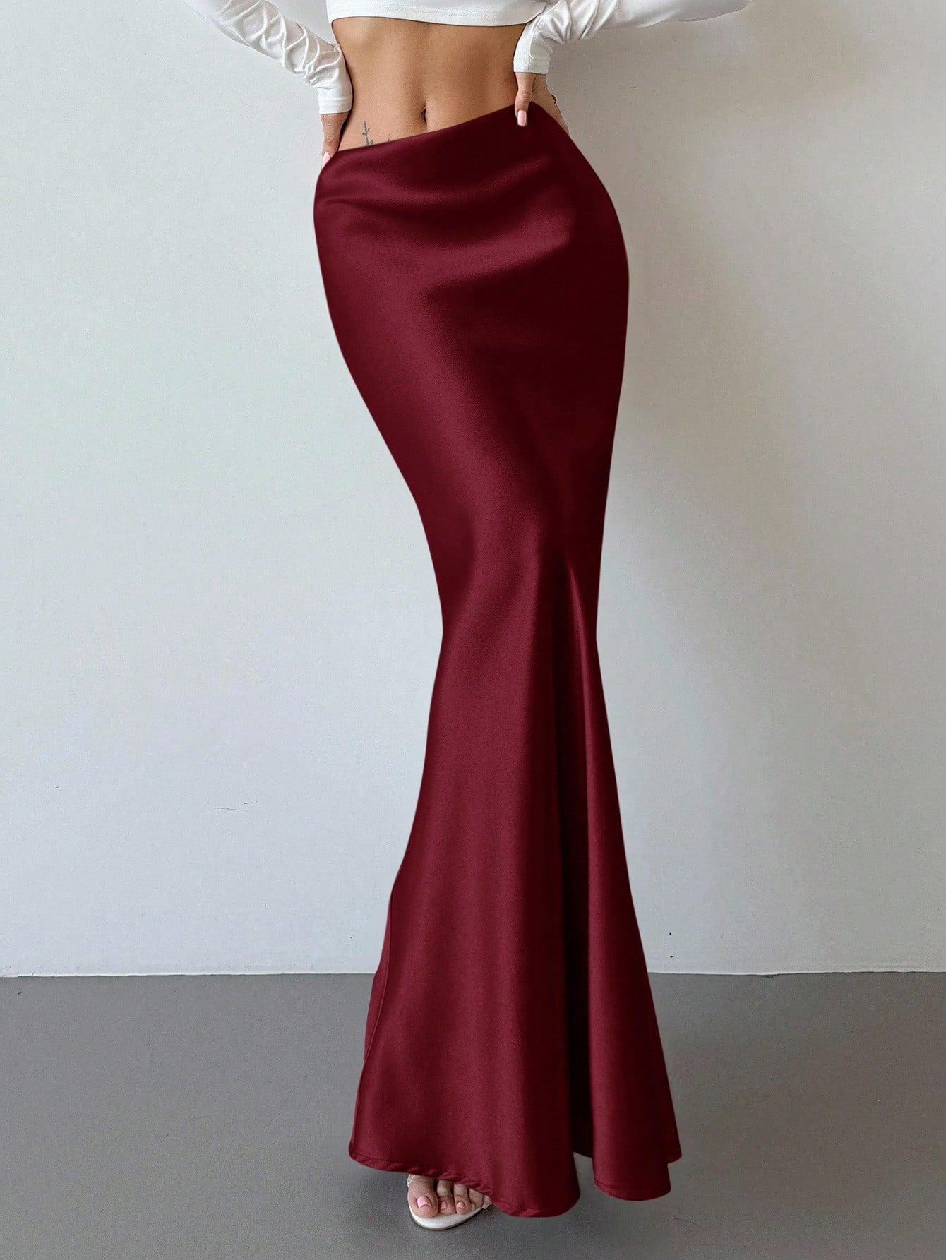 Elegant black satin high waist mermaid maxi skirt for women featuring a skinny fit and floor-length silhouette.