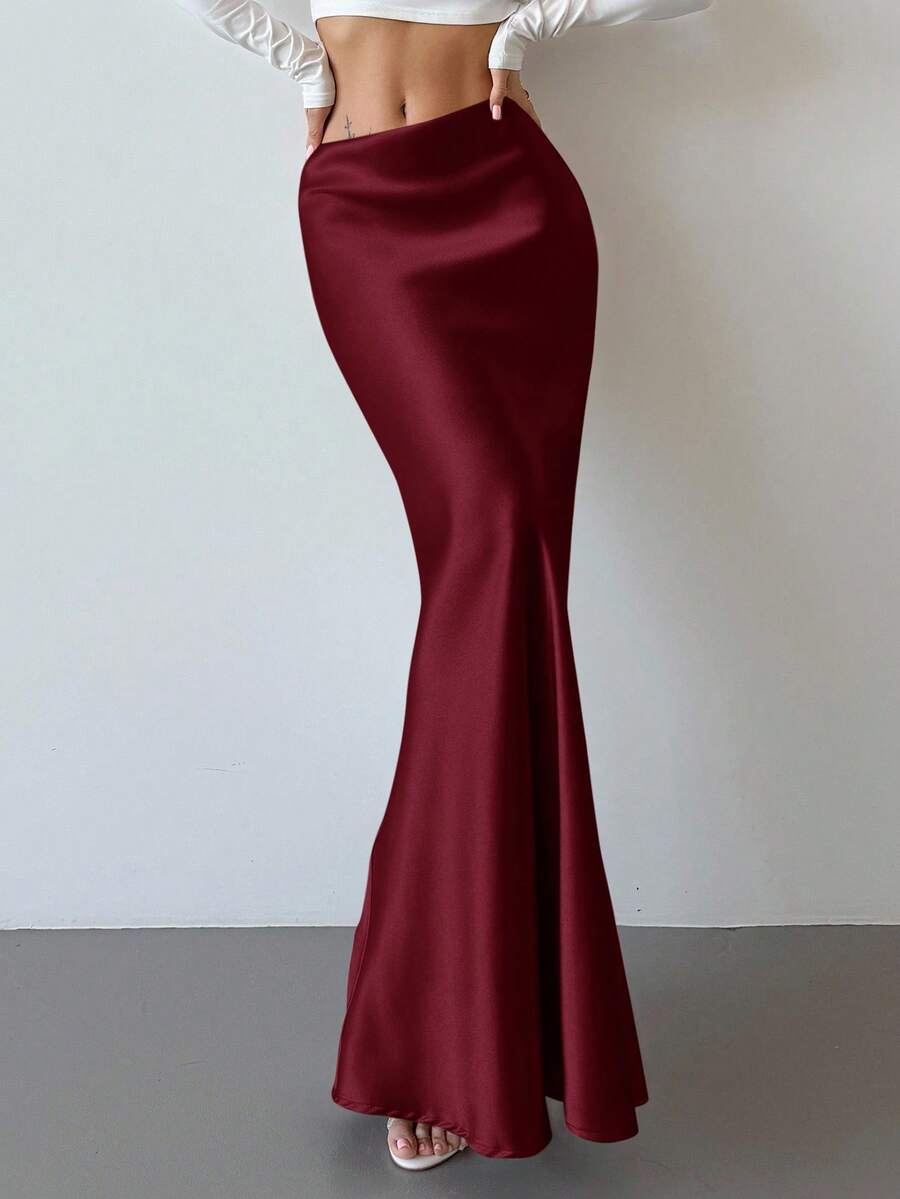 Elegant black satin high waist mermaid maxi skirt for women featuring a skinny fit and floor-length silhouette.