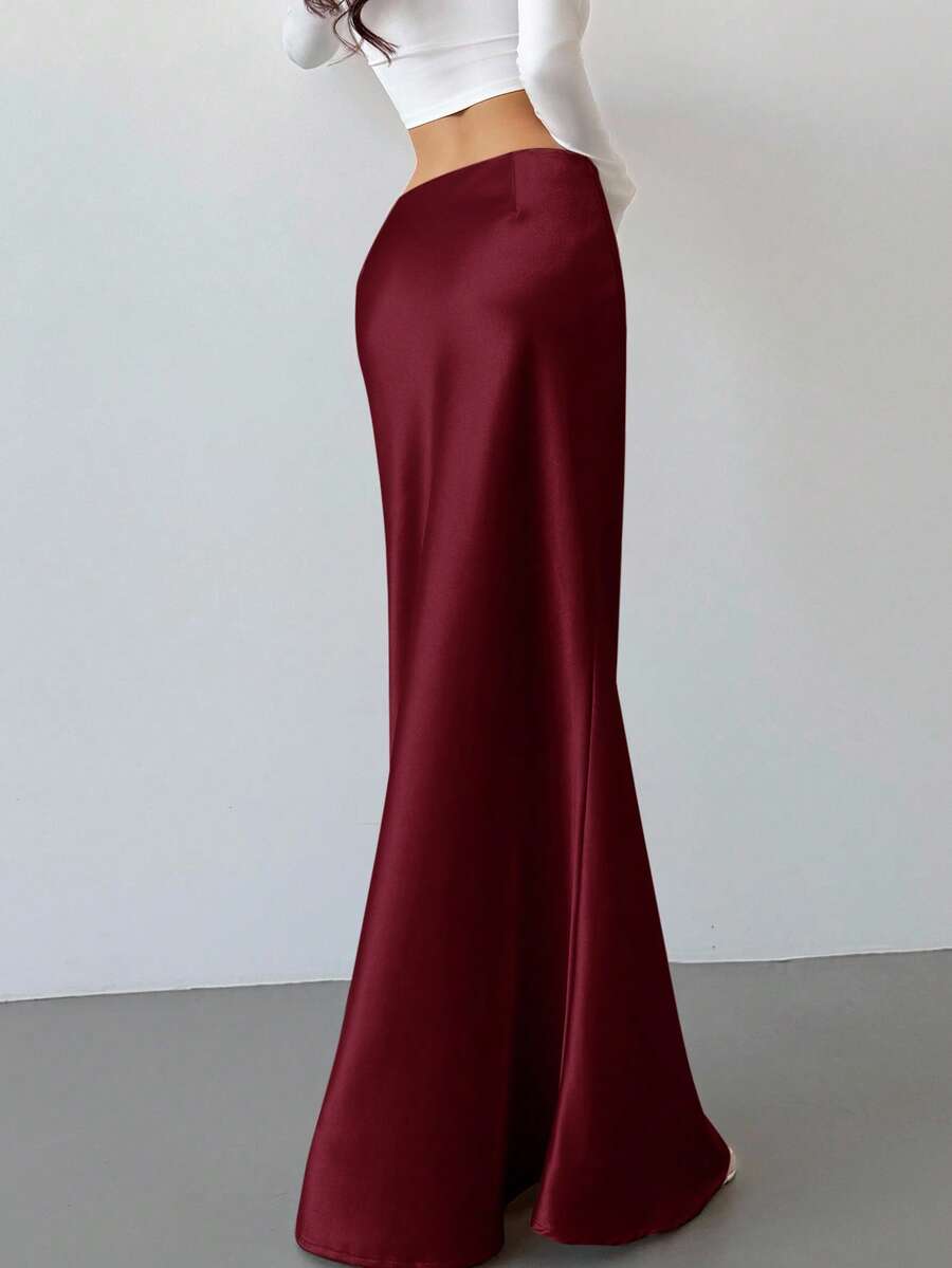 Elegant black satin high waist mermaid maxi skirt for women featuring a skinny fit and floor-length silhouette.