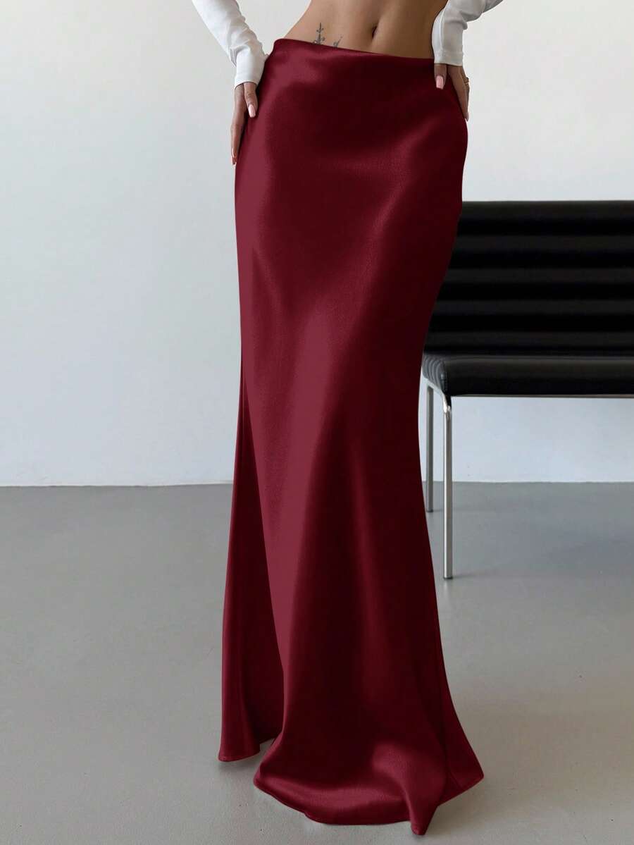 Elegant black satin high waist mermaid maxi skirt for women featuring a skinny fit and floor-length silhouette.