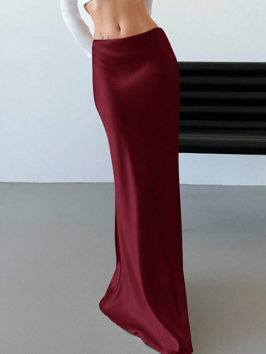 Elegant black satin high waist mermaid maxi skirt for women featuring a skinny fit and floor-length silhouette.