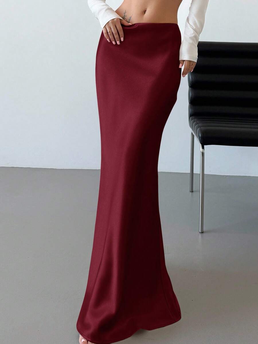Elegant black satin high waist mermaid maxi skirt for women featuring a skinny fit and floor-length silhouette.