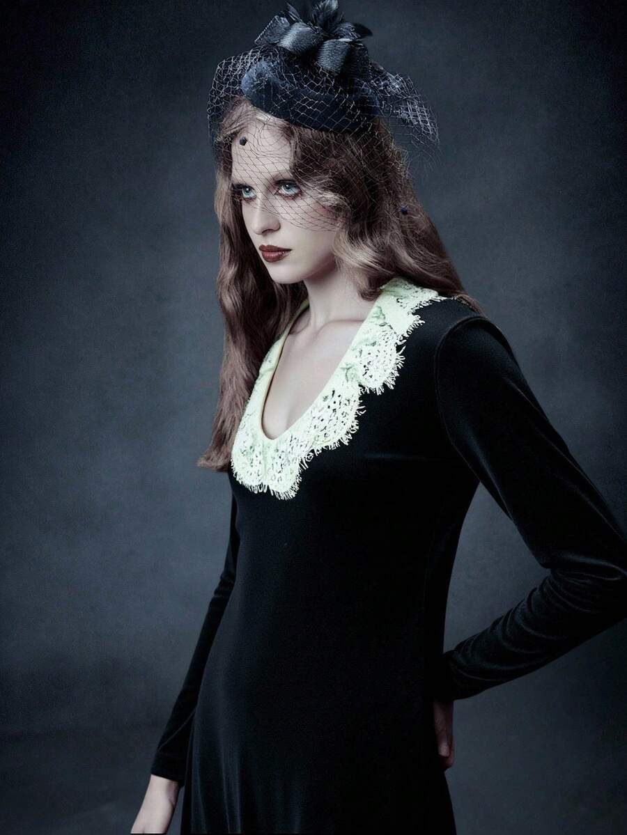 Black velvet gothic dress for women featuring contrast lace trim, sweetheart neckline, long sleeves, and a flared high waist silhouette.