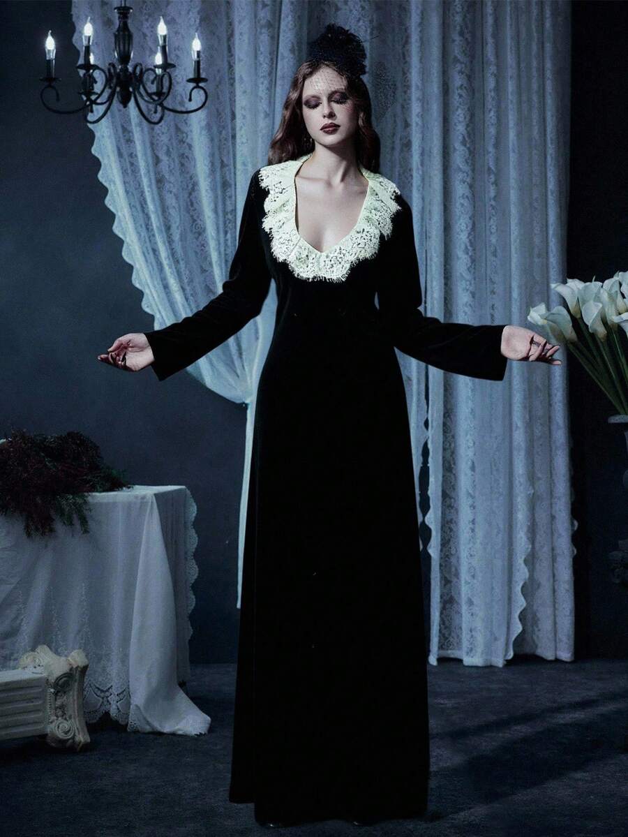 Black velvet gothic dress for women featuring contrast lace trim, sweetheart neckline, long sleeves, and a flared high waist silhouette.