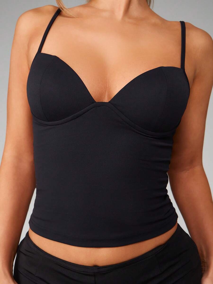 Women’s plain backless cami top with spaghetti straps and a slim fit, designed in high-stretch knitted fabric for casual beach and vacation wear.