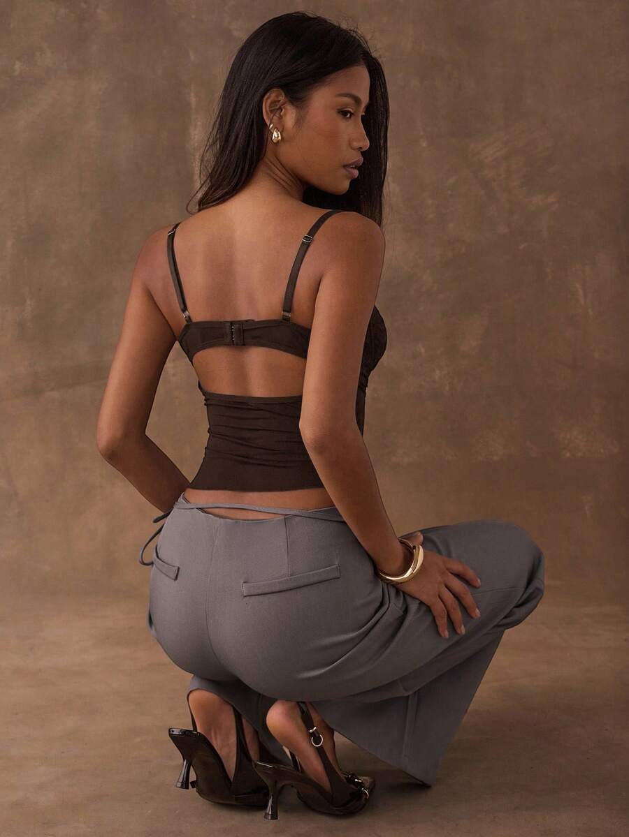 Women's black contrast lace camisole with spaghetti straps, cup detail, semi-sheer finish, and slim fit for going out or date night.