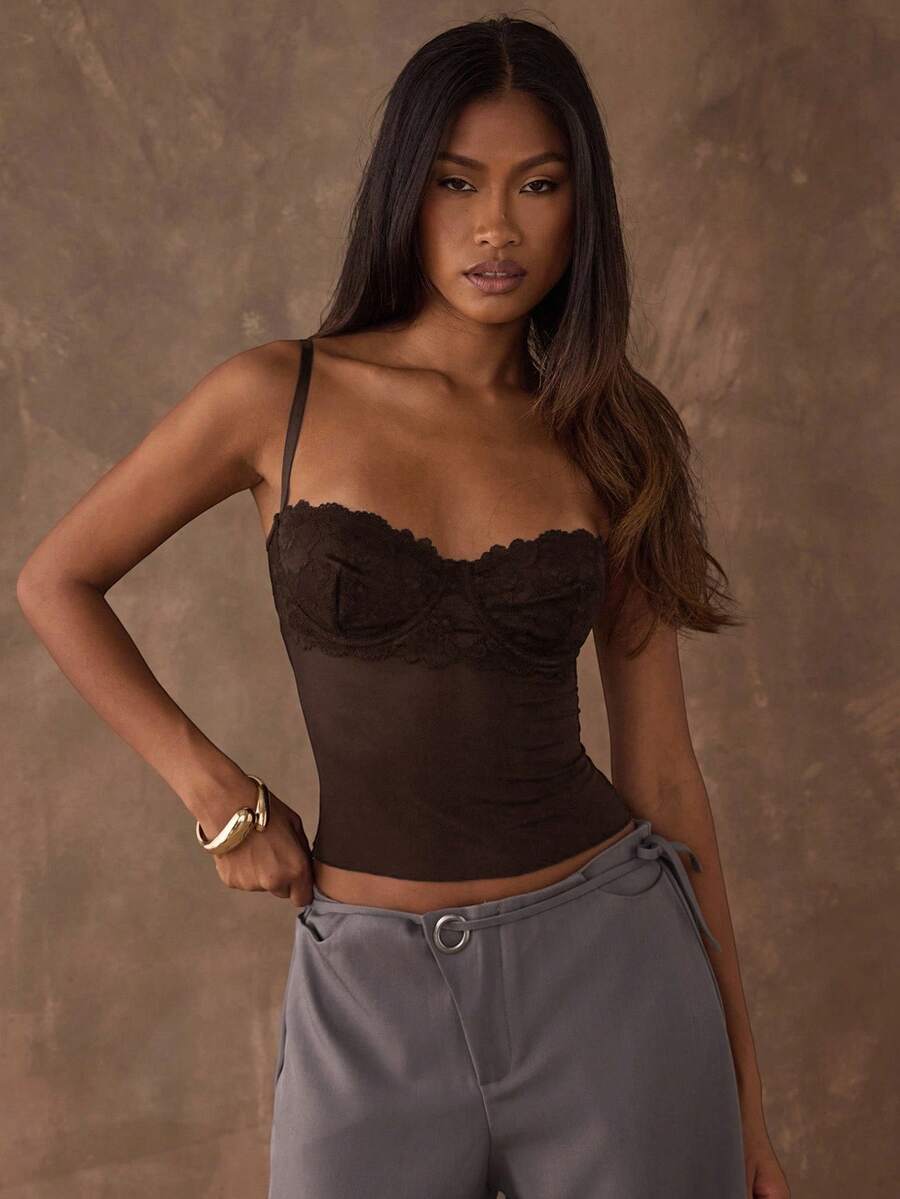 Women's black contrast lace camisole with spaghetti straps, cup detail, semi-sheer finish, and slim fit for going out or date night.