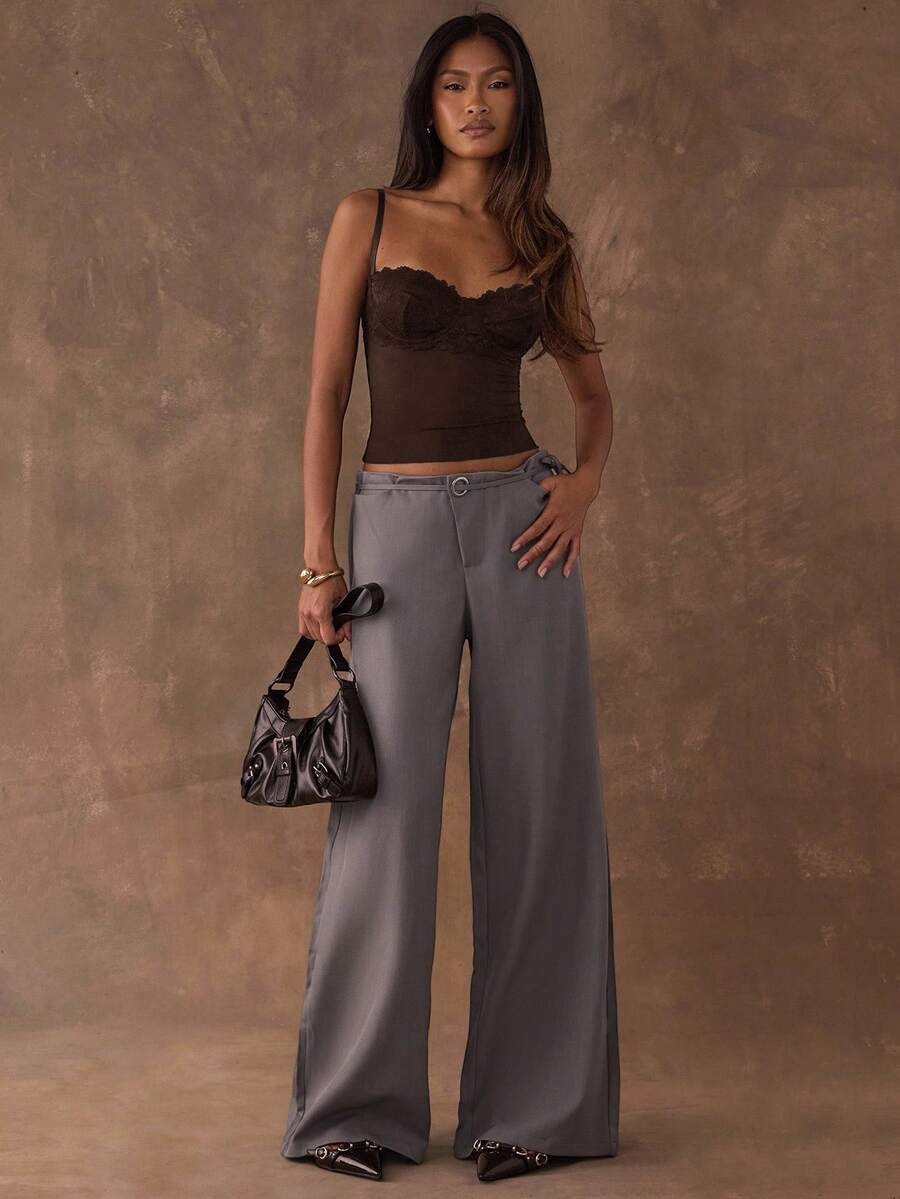 Women's black contrast lace camisole with spaghetti straps, cup detail, semi-sheer finish, and slim fit for going out or date night.