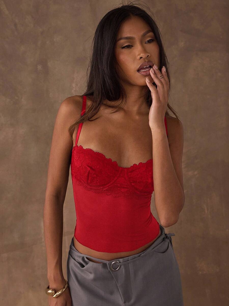 Women's black contrast lace camisole with spaghetti straps, cup detail, semi-sheer finish, and slim fit for going out or date night.