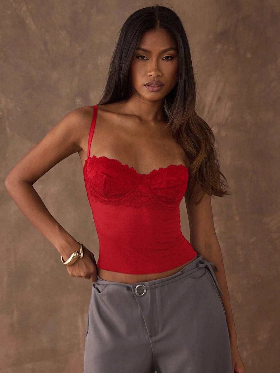Women's black contrast lace camisole with spaghetti straps, cup detail, semi-sheer finish, and slim fit for going out or date night.