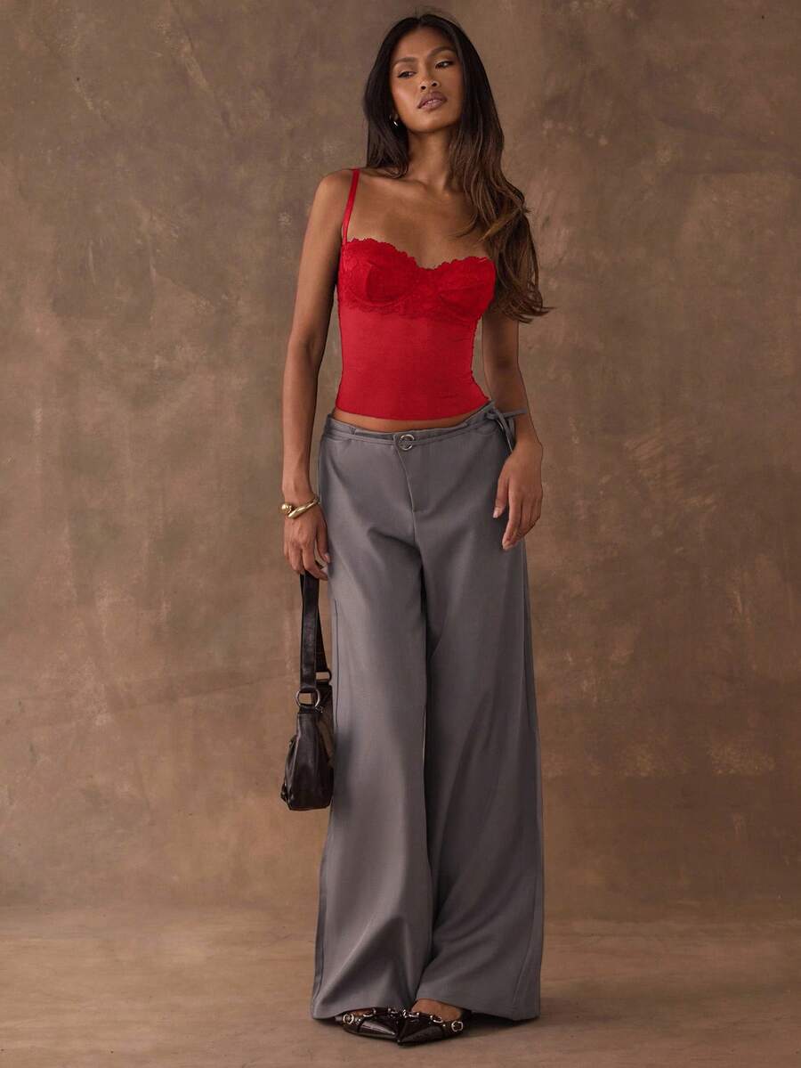 Women's black contrast lace camisole with spaghetti straps, cup detail, semi-sheer finish, and slim fit for going out or date night.