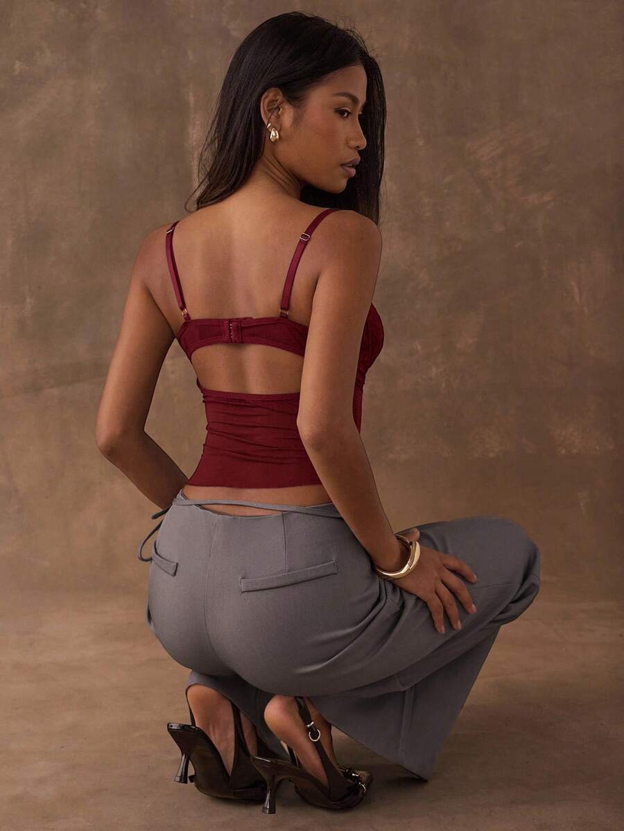 Women's black contrast lace camisole with spaghetti straps, cup detail, semi-sheer finish, and slim fit for going out or date night.