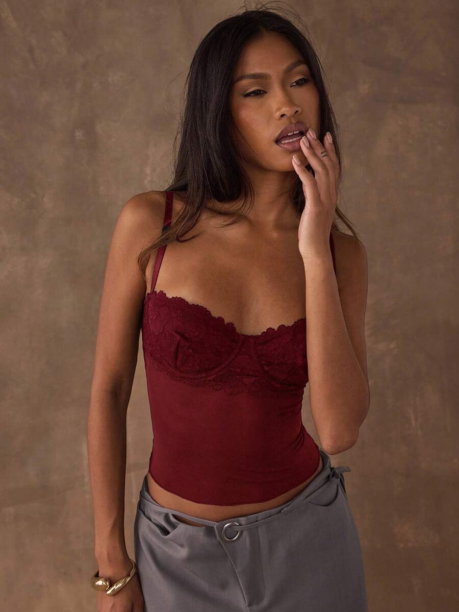 Women's black contrast lace camisole with spaghetti straps, cup detail, semi-sheer finish, and slim fit for going out or date night.