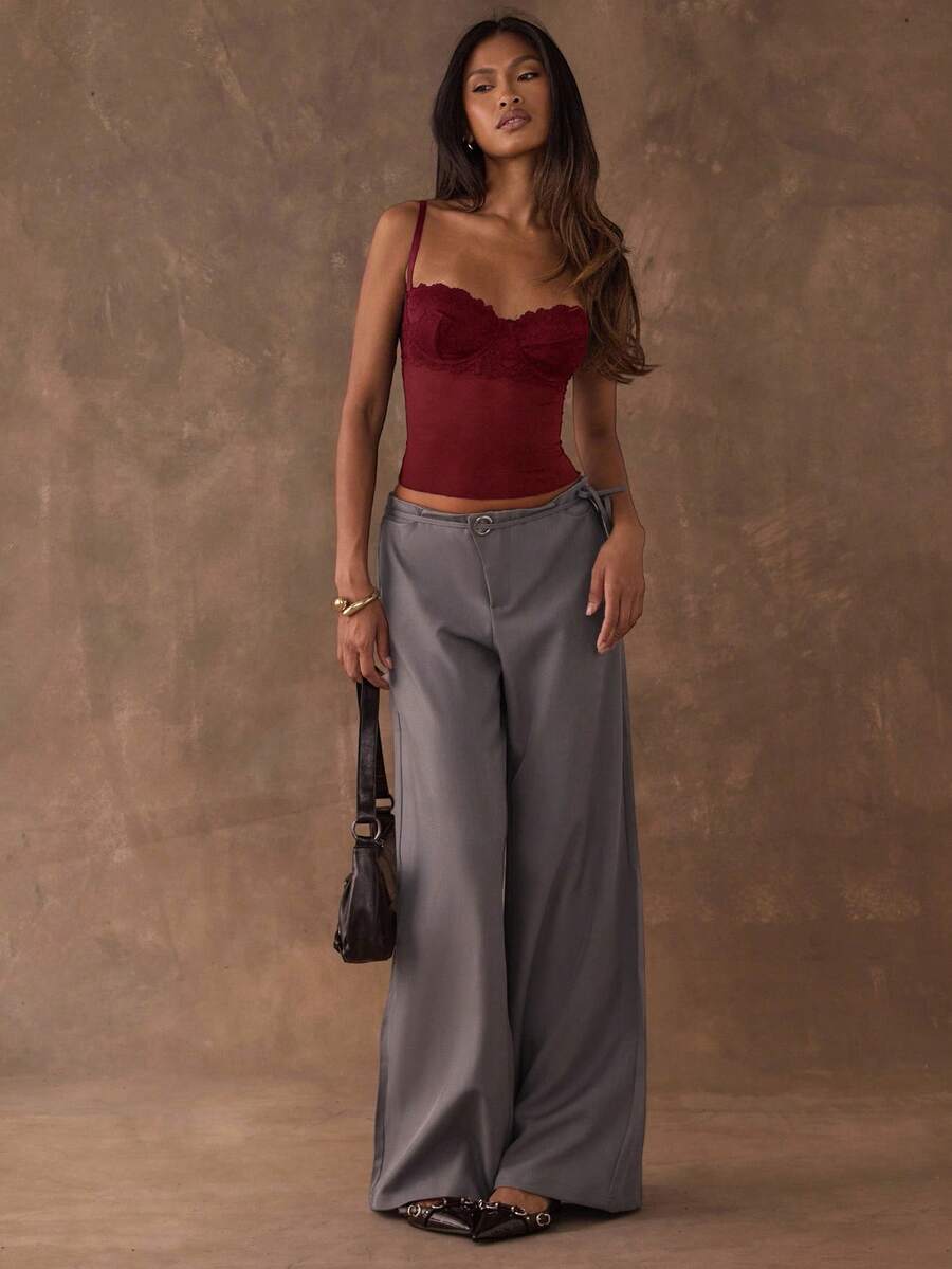 Women's black contrast lace camisole with spaghetti straps, cup detail, semi-sheer finish, and slim fit for going out or date night.