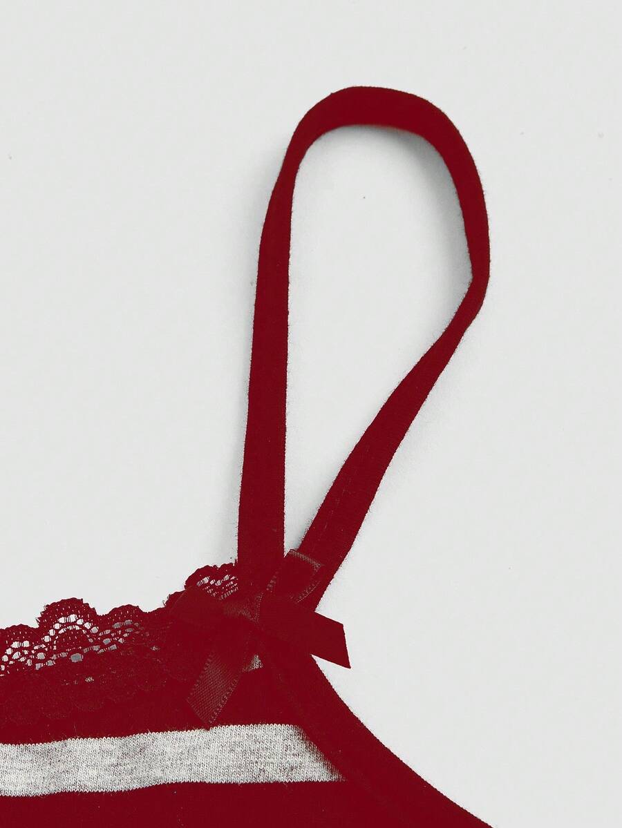 Burgundy rib-knit spaghetti strap camisole top featuring contrast lace patchwork trim, a decorative bow, and detailed cat embroidery.
