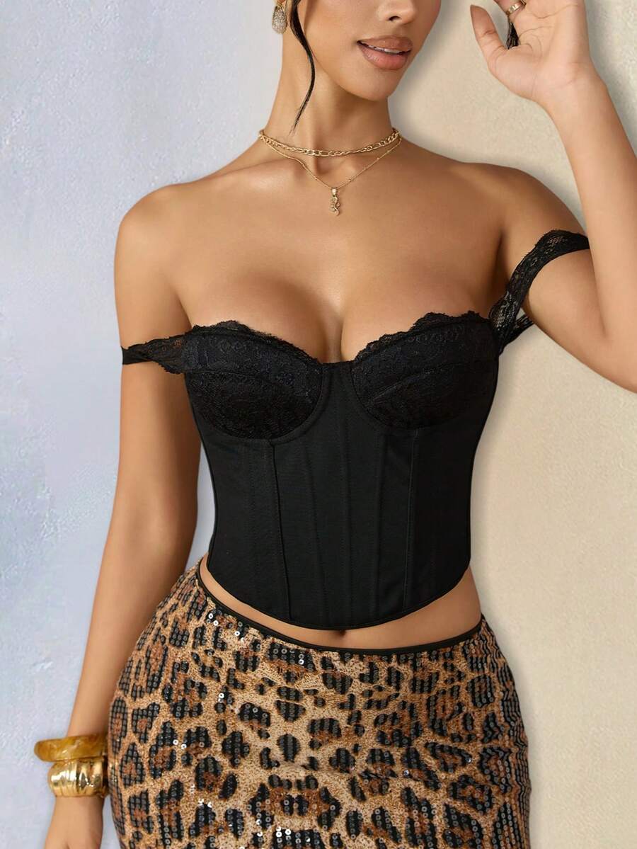Women's black cropped bustier top featuring contrast lace detailing, off the shoulder neckline, boned waist cincher, and lace-up backless design.