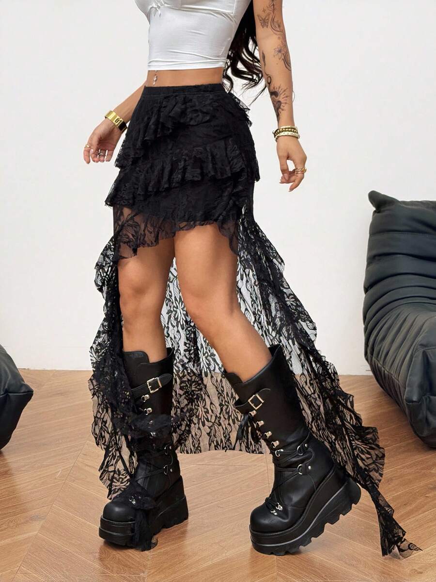 Women's black asymmetrical long skirt with ruffle hem and low waist design in knitted fabric.