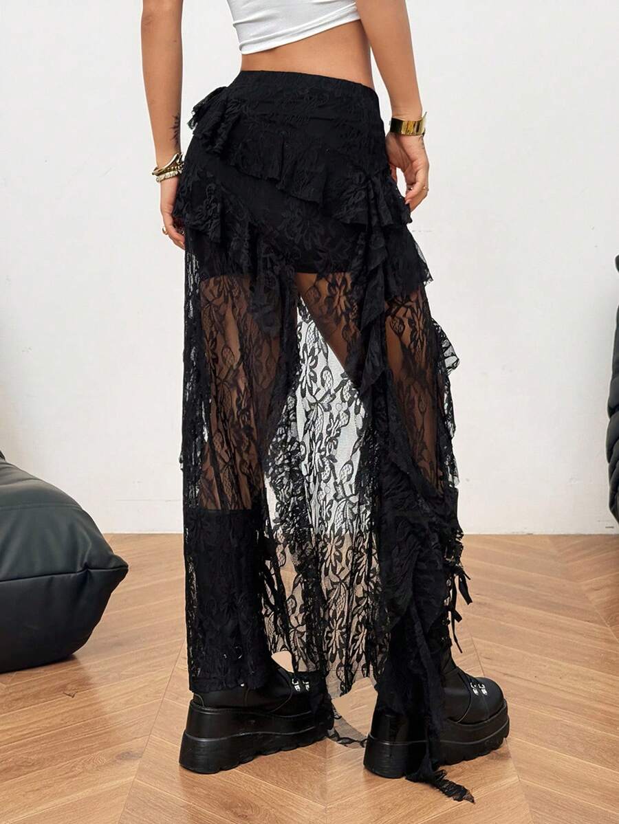 Women's black asymmetrical long skirt with ruffle hem and low waist design in knitted fabric.