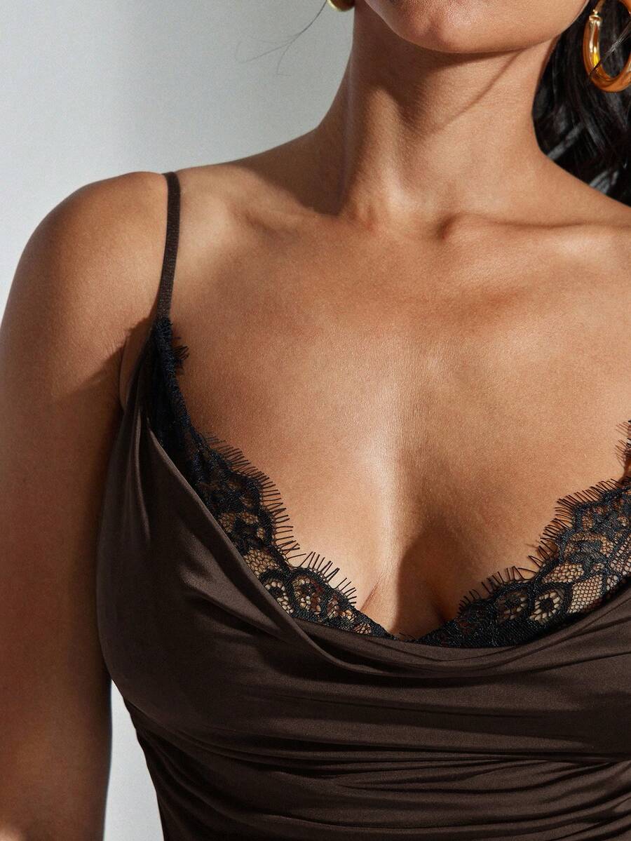 Women's solid color draped neck cami top featuring contrast lace trim, backless design, and delicate spaghetti straps in a slim fit style.