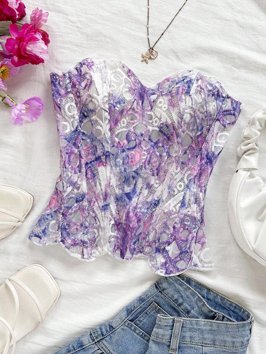 Strapless floral corset top with lace-up detail, asymmetrical hem, and slim fit for women in a boho vacation style.