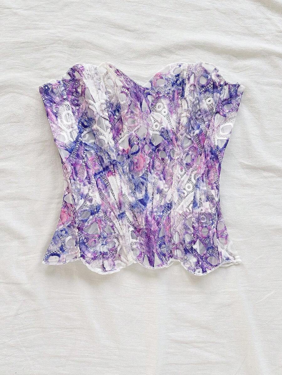 Strapless floral corset top with lace-up detail, asymmetrical hem, and slim fit for women in a boho vacation style.