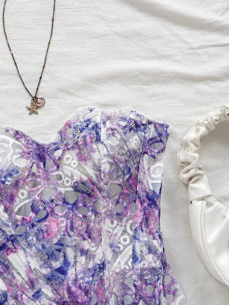 Strapless floral corset top with lace-up detail, asymmetrical hem, and slim fit for women in a boho vacation style.