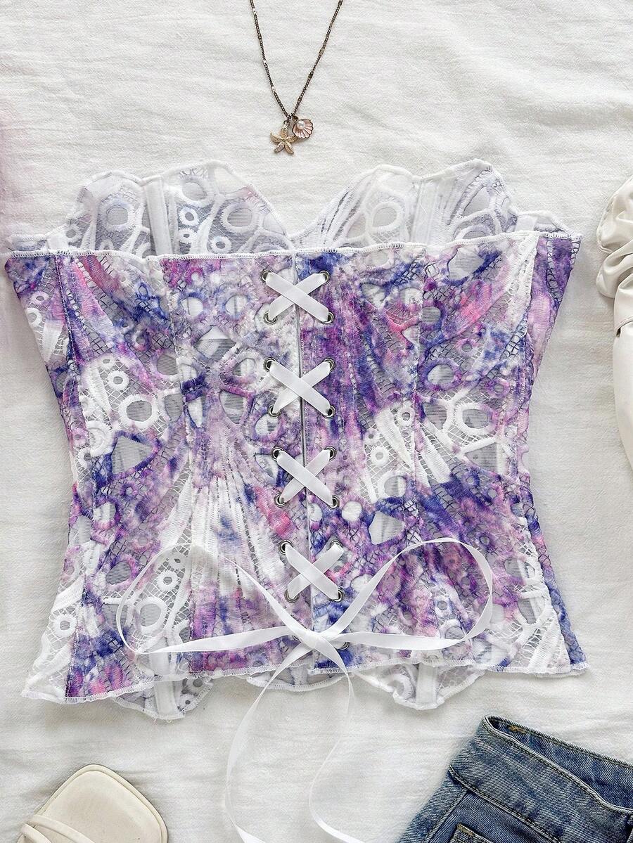 Strapless floral corset top with lace-up detail, asymmetrical hem, and slim fit for women in a boho vacation style.