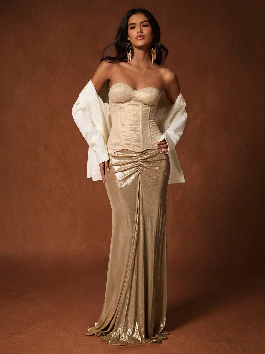 Women's brown strapless bustier crop top featuring a lace-up backless design with grommet eyelets and a boned corset fit.